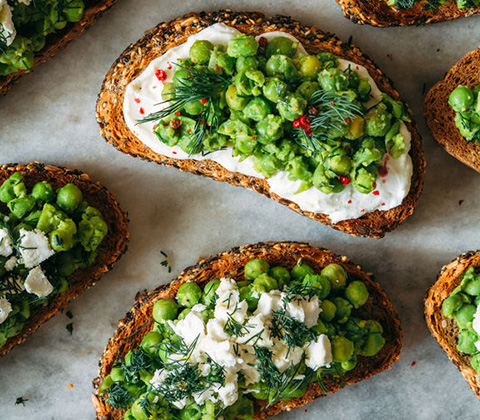 Delicious pea and goat cheese crostini with herbs